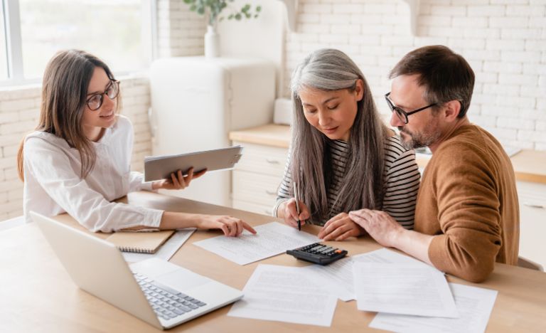 Mother and son working with attorney on estate plans